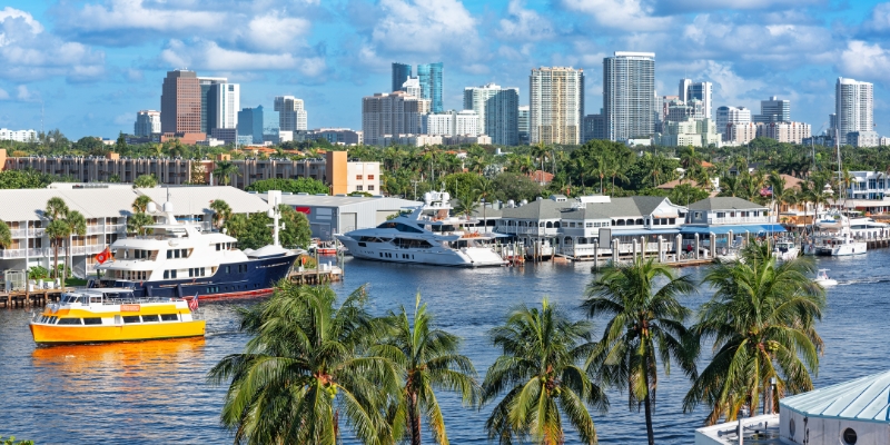 View of Miami's skyline featuring tall buildings against a clear blue sky, highlighting the water taxi to experience.