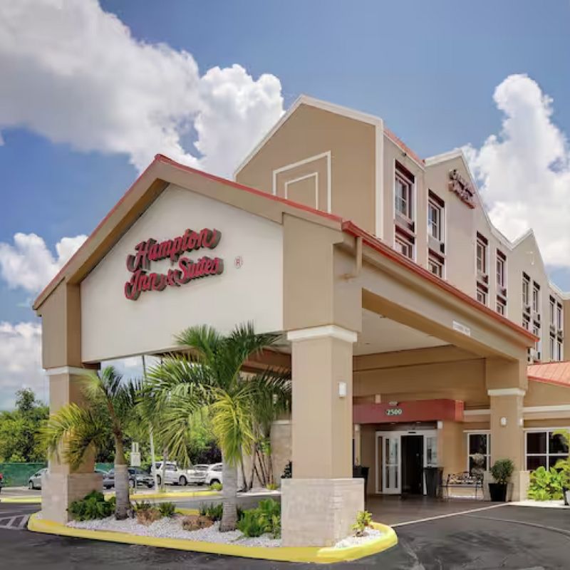 Hampton Inn & Suites Ft. Lauderdale exterior view, showcasing modern architecture and welcoming entrance for travelers.