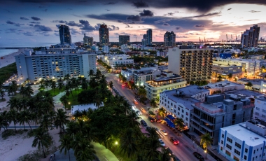 The city of Miami at dusk, highlighting the skyline's beauty and vibrant colors, with convenient access to major highways.